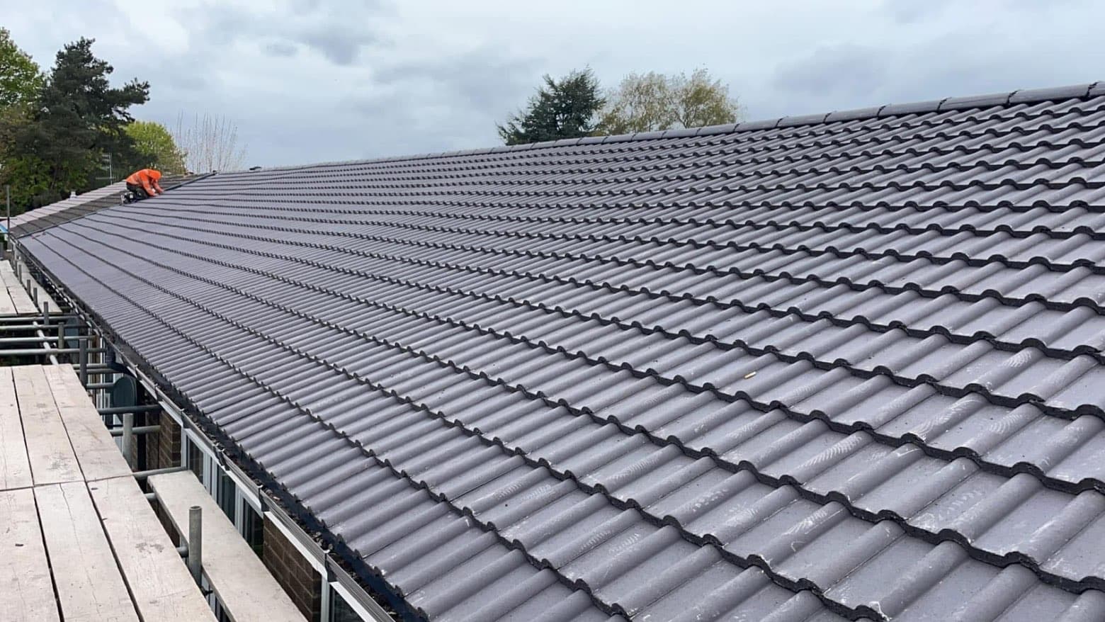 Hipped slate re-roof and rebuilt chimney by RML Roofing Services